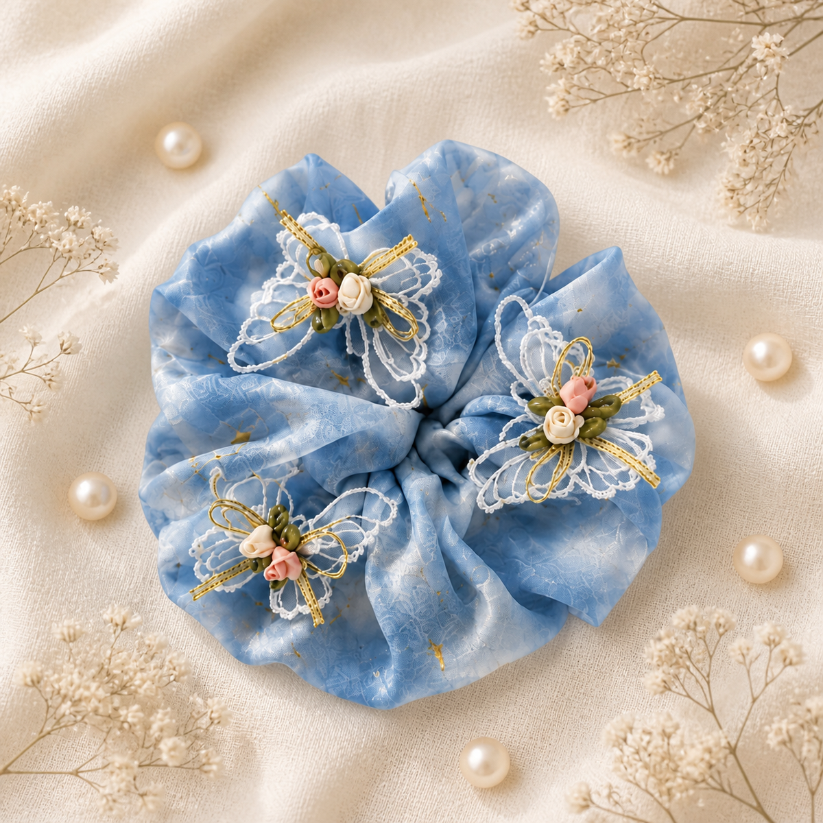 Blue organza butterfly pearl oversized scrunchie flat lay