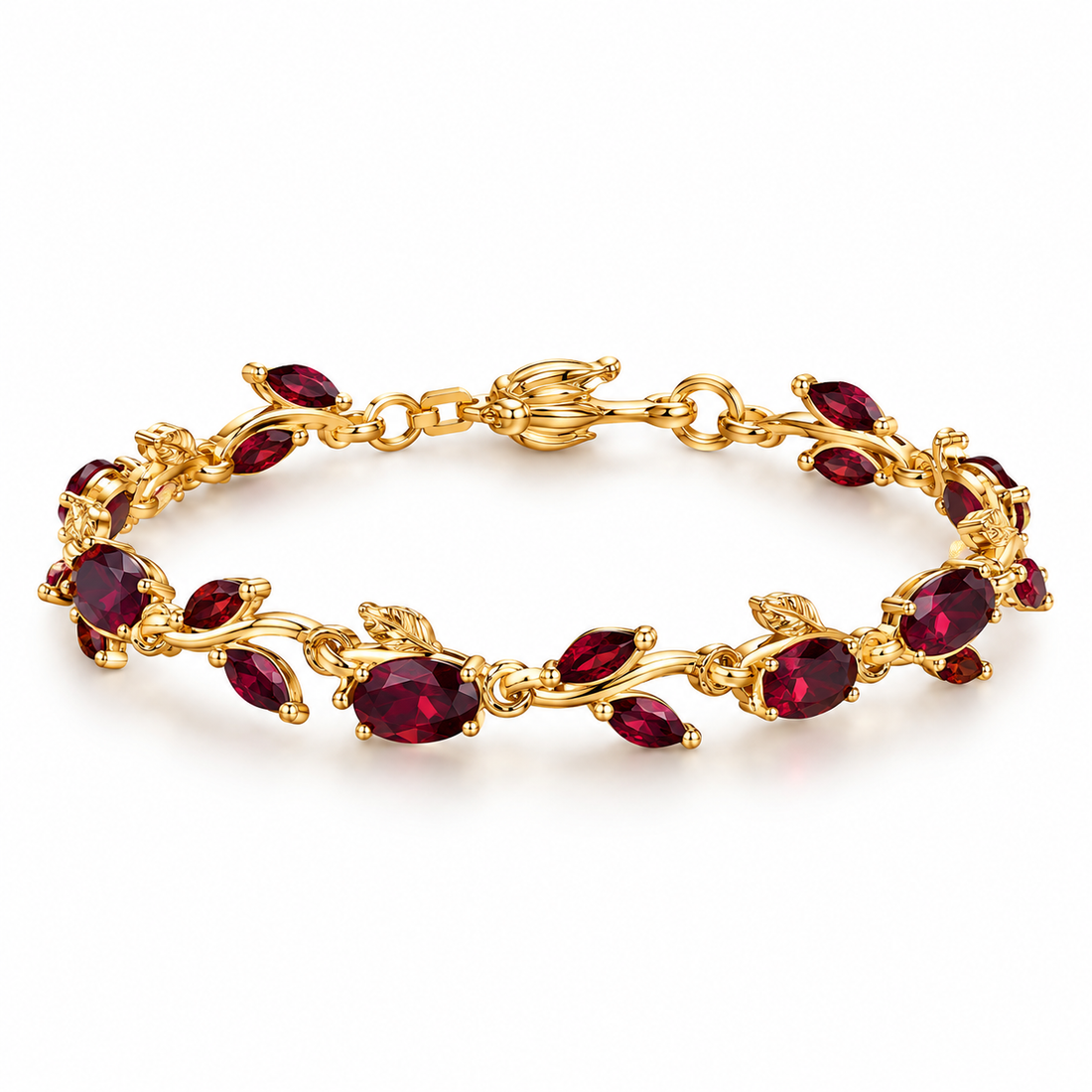 Gold-tone leaf vine bracelet with red teardrop stones.