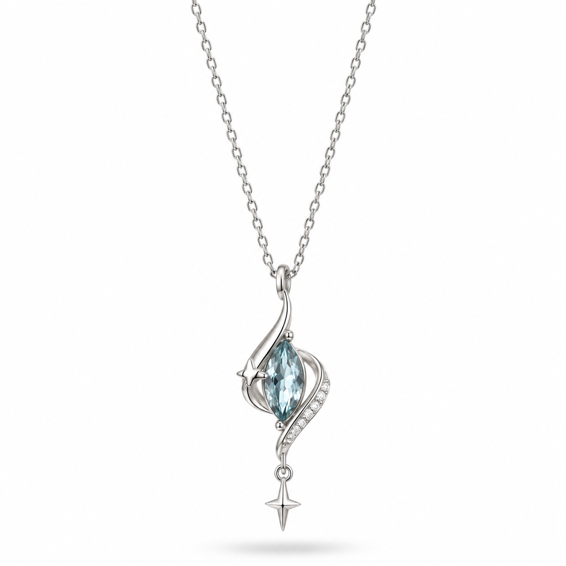 Silver-tone necklace with an aqua teardrop stone and small star drop.