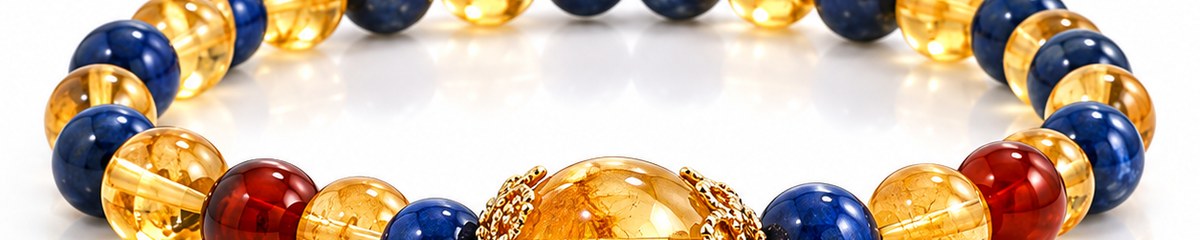 Blue and golden beaded bracelet with a large translucent amber centerpiece bead.