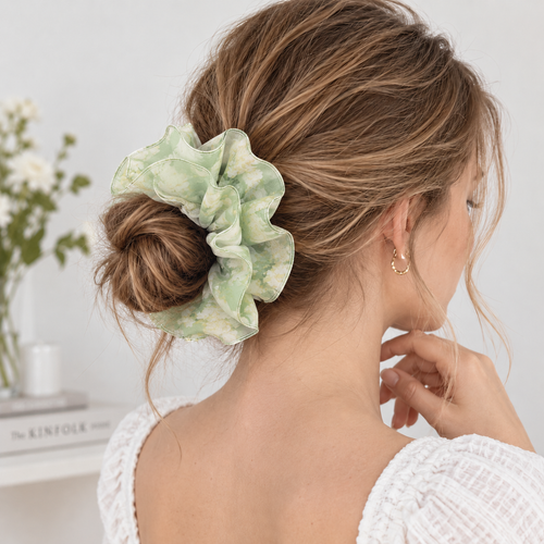 Adjustable floral scrunchie styled in an everyday hairstyle