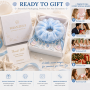 Ice blue mermaid lace scrunchie displayed in gift-ready packaging