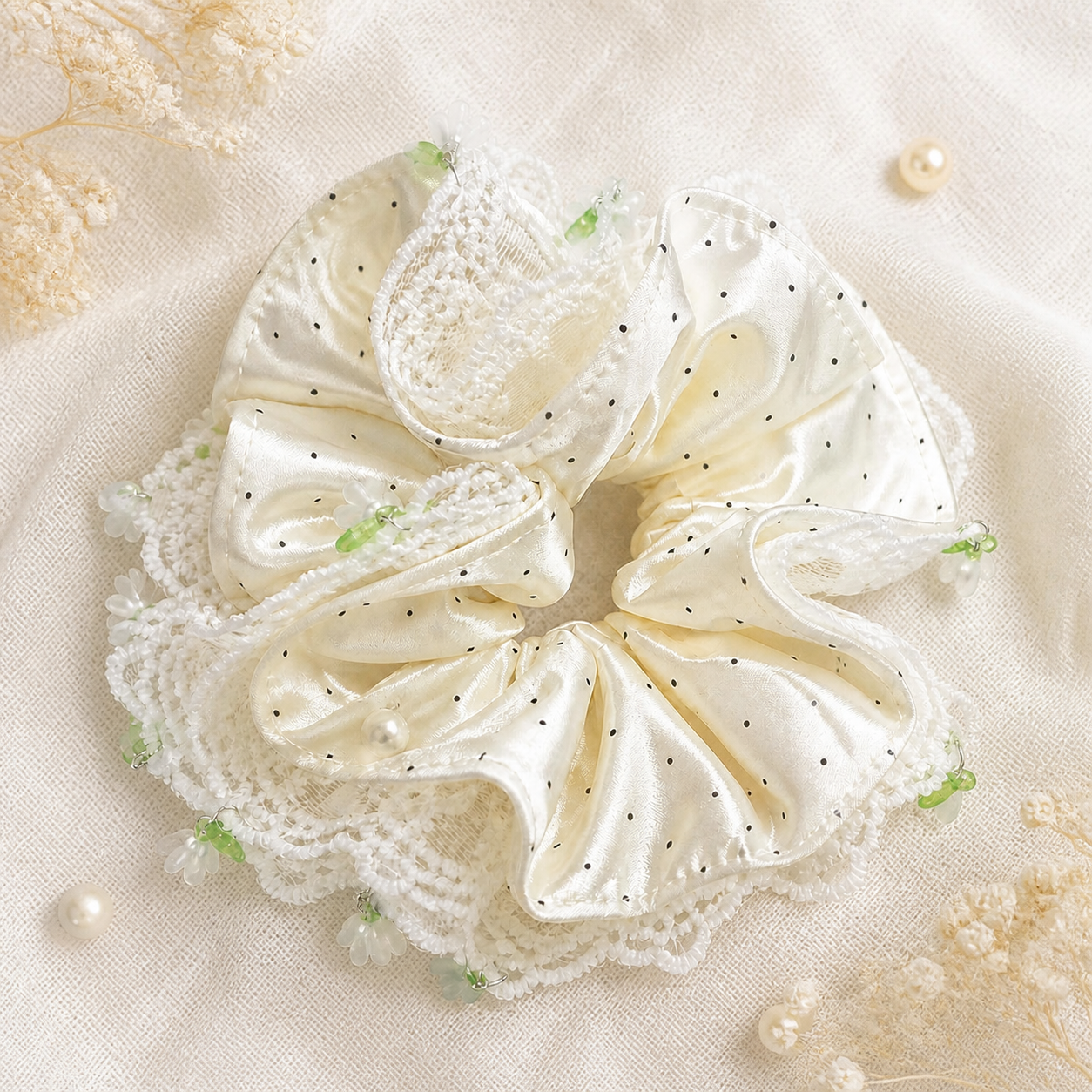 Ivory polka dot satin and lace oversized scrunchie flat lay
