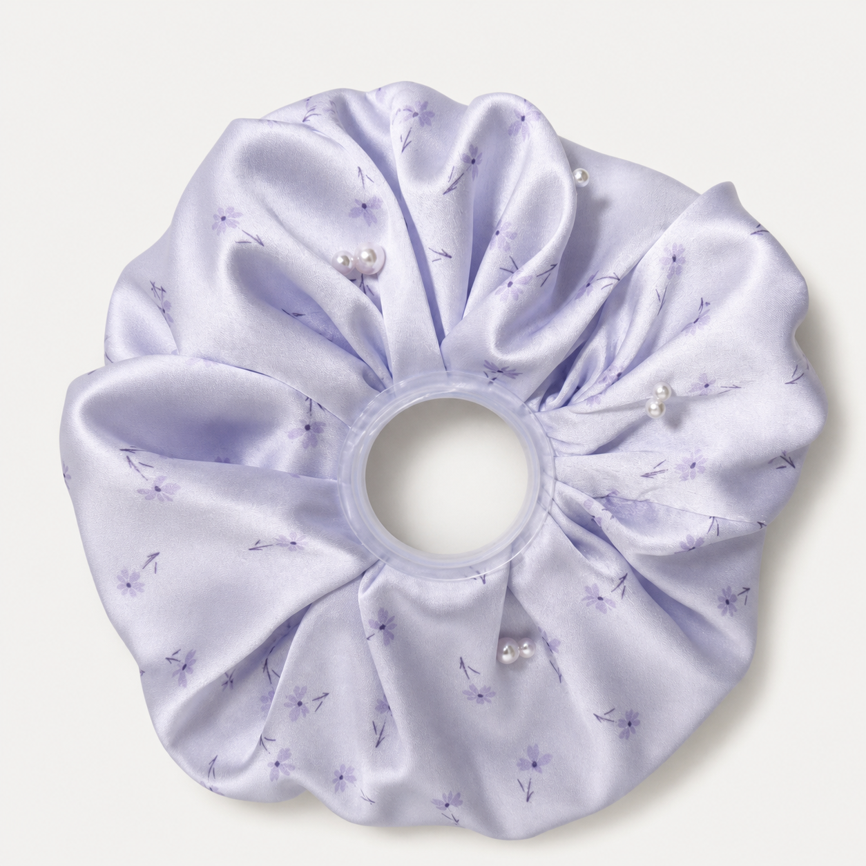 Pale lilac floral pearl satin oversized scrunchie on a neutral gray-white studio background
